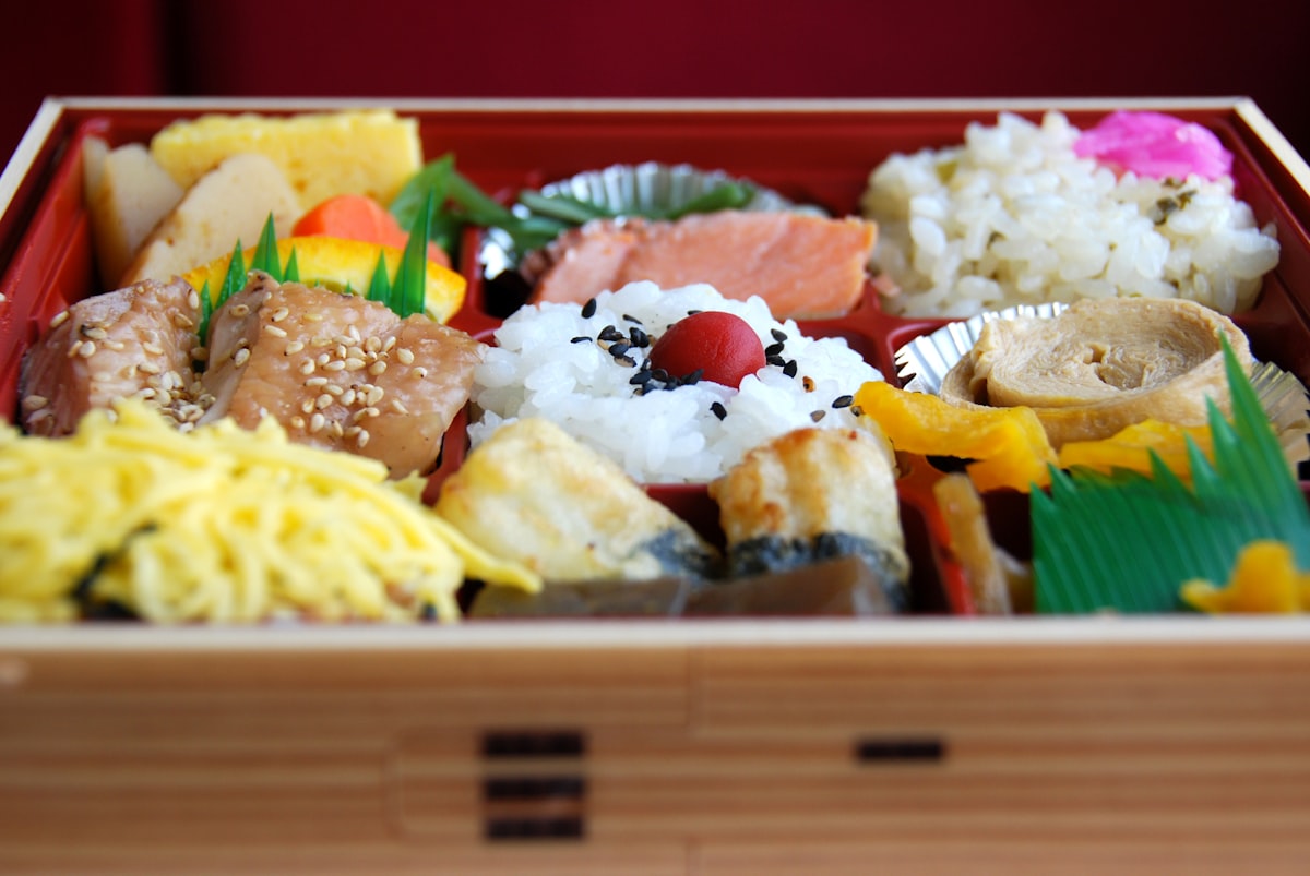 A wooden box filled with different types of food