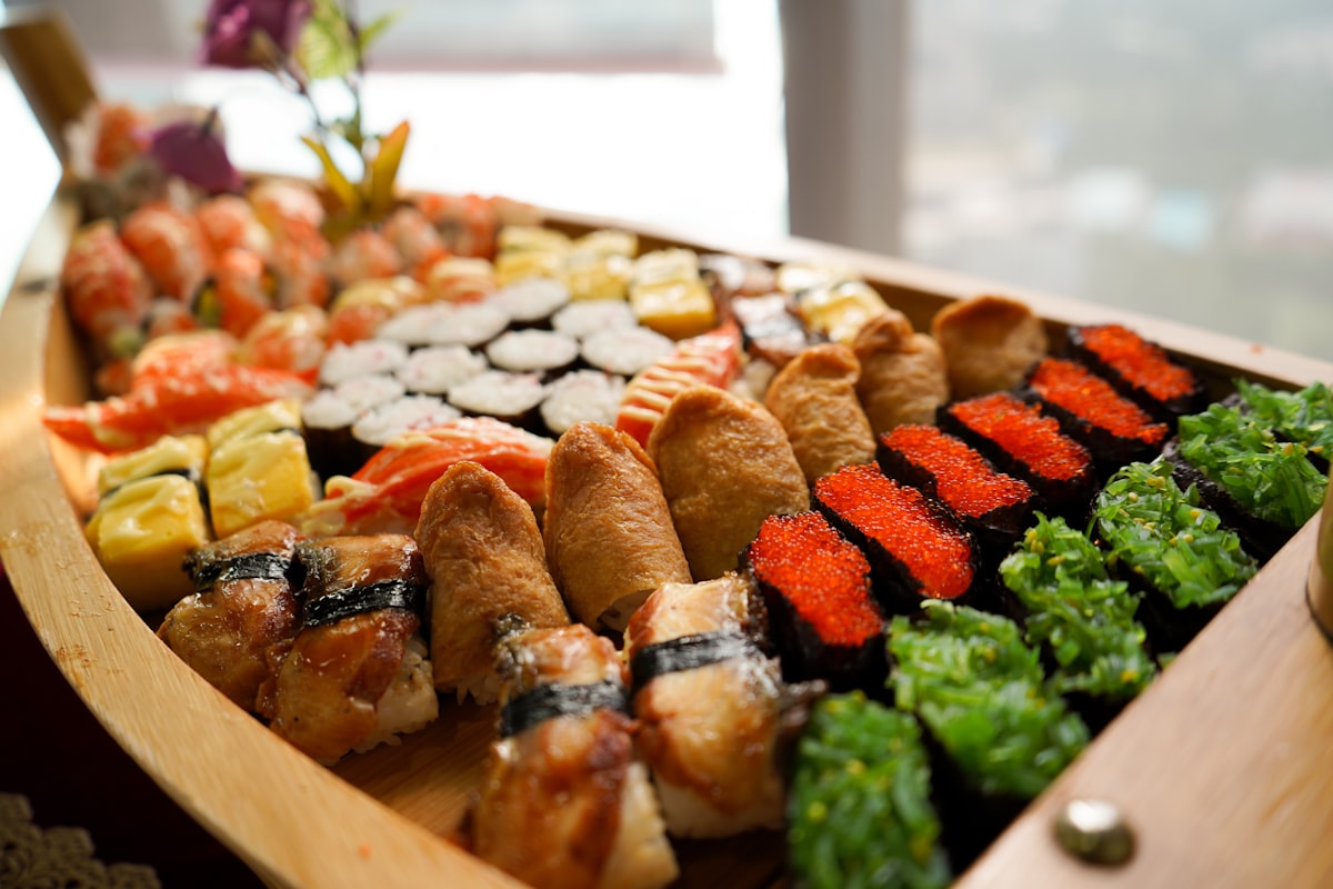 A wooden boat filled with lots of different types of food