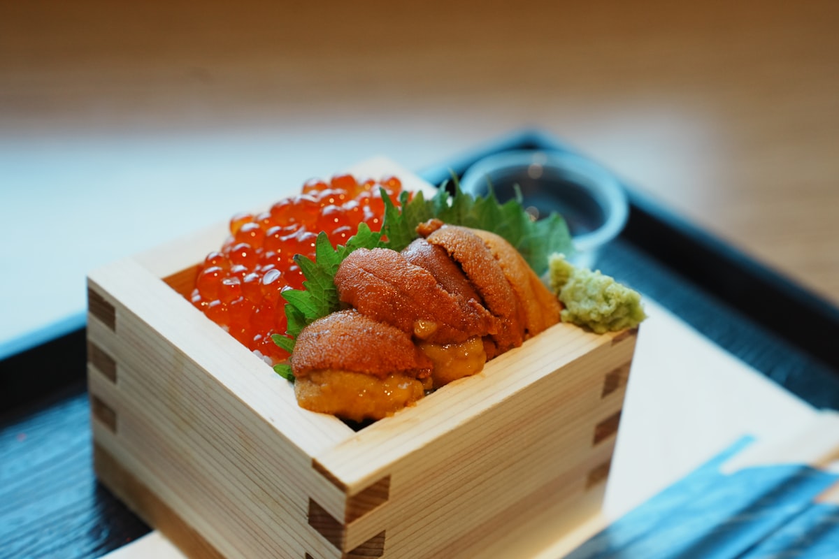 Sea urchin and salmon roe served in a wooden box