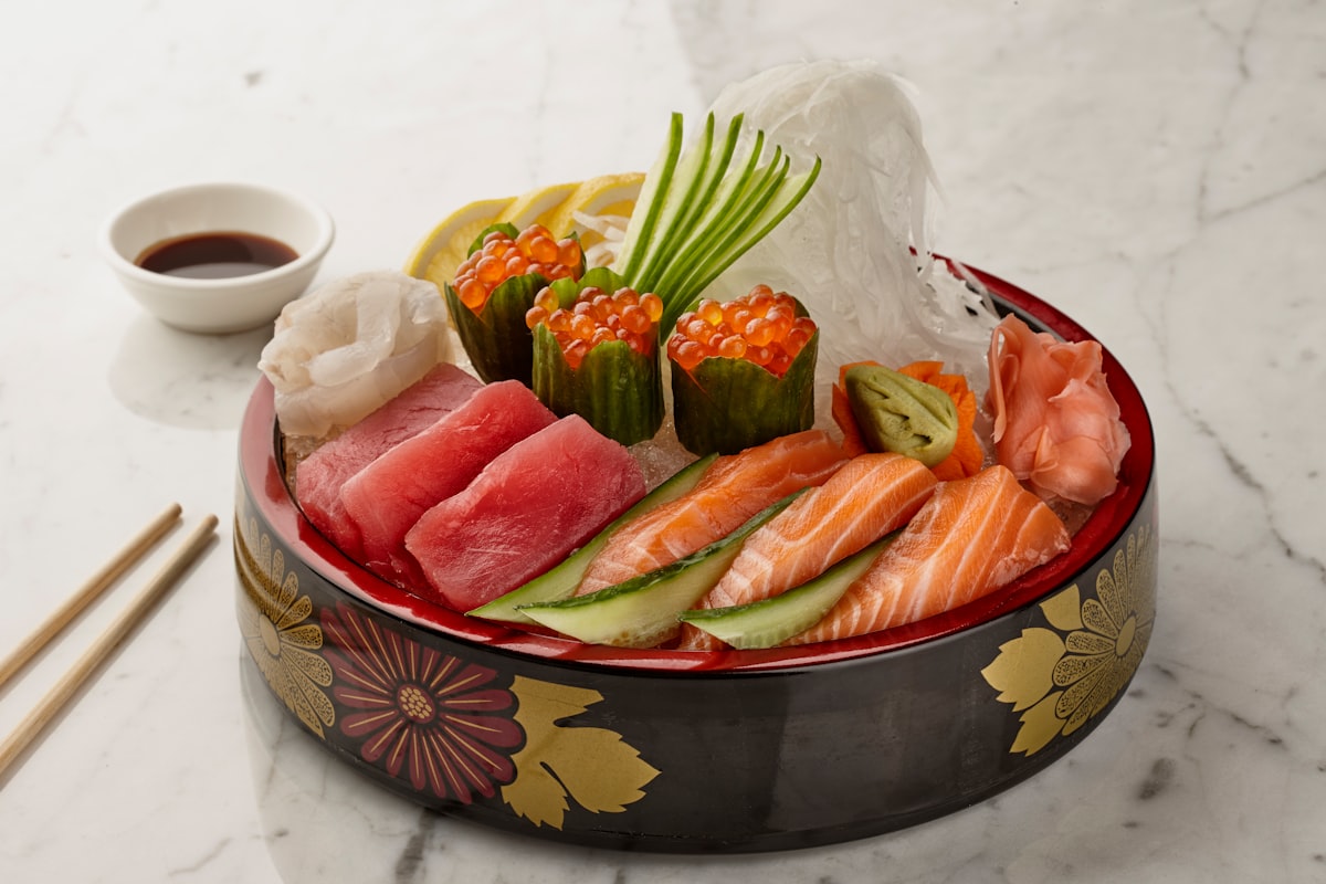 A close up of a bowl of food with chopsticks